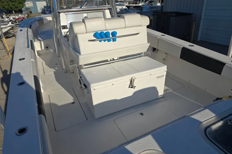 Slide: The Image of 2012 Fountain 38 CC Tournament Edition boat interior with seating and storage. - 10