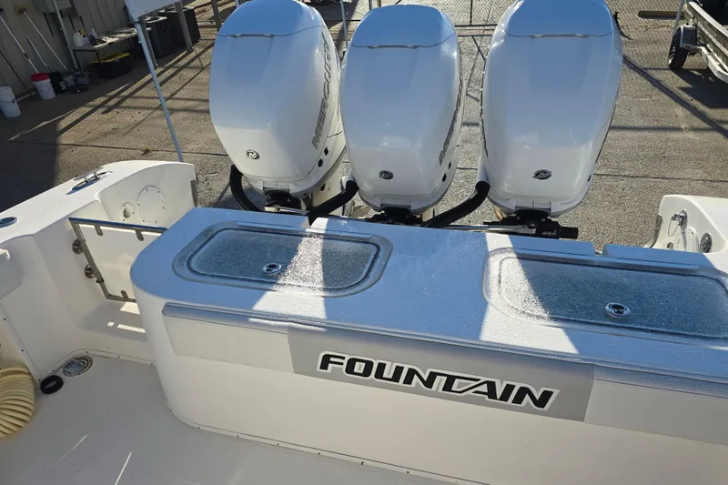 Slide: The Image of 2012 Fountain 38 CC Tournament Edition boat with triple Mercury outboard engines. - 11
