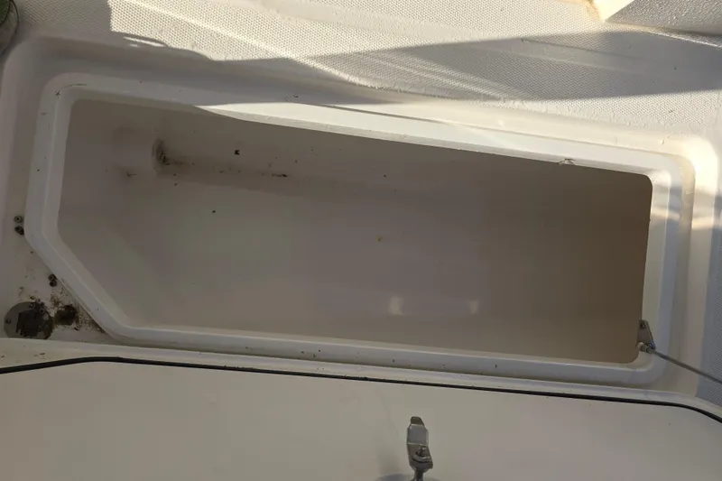 Slide: The Image of Open storage compartment on a 2012 Fountain 38 CC Tournament Edition boat. - 21