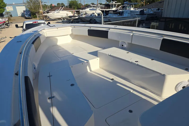 Slide: The Image of 2012 Fountain 38 CC Tournament Edition boat interior, spacious seating, and storage compartments. - 23