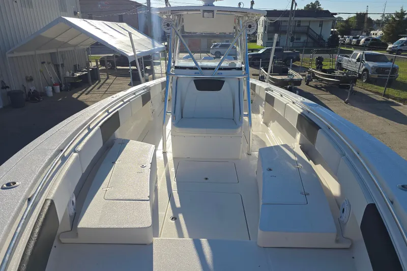 Slide: The Image of 2012 Fountain 38 CC Tournament Edition boat interior with seating and storage compartments. - 24