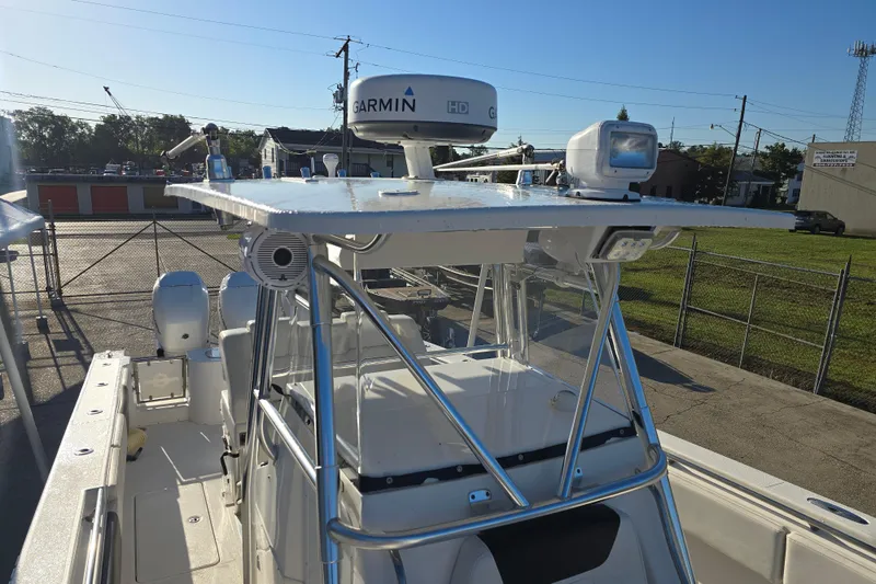 Slide: The Image of 2012 Fountain 38 CC Tournament Edition boat with Garmin radar, docked in a marina. - 30