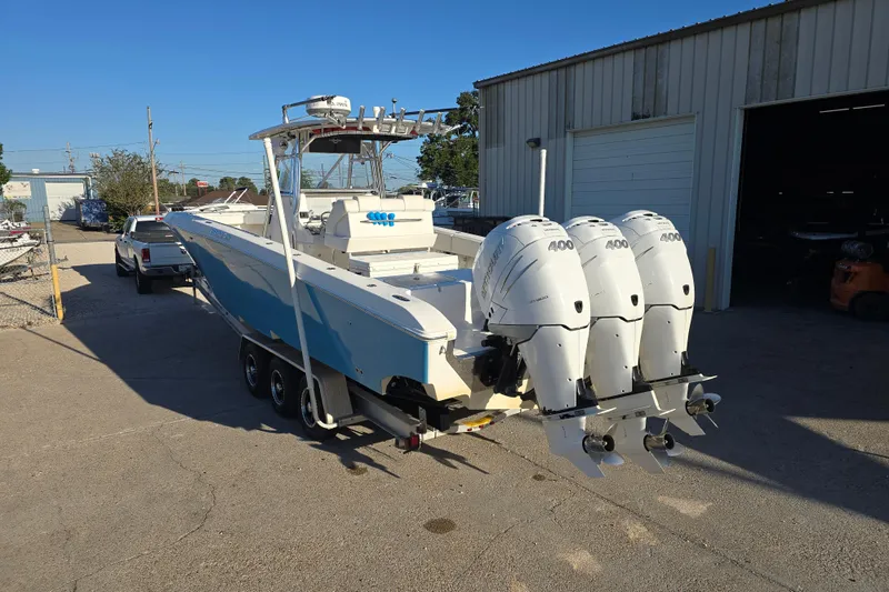 Slide: The Image of 2012 Fountain 38 CC Tournament Edition boat with triple Mercury 400 engines on trailer. - 4