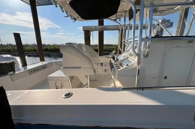 Slide: The Image of 2012 Fountain 38 CC Tournament Edition boat interior with helm and seating. - 43