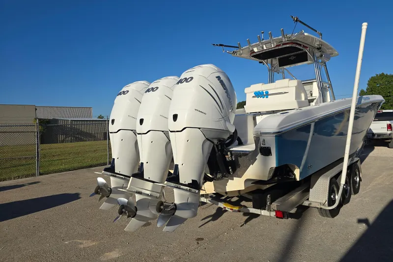 Slide: The Image of 2012 Fountain 38 CC Tournament Edition boat with triple outboard engines on a trailer. - 5