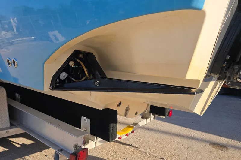 Slide: The Image of Rear view of a 2012 Fountain 38 CC Tournament Edition boat on a trailer. - 8