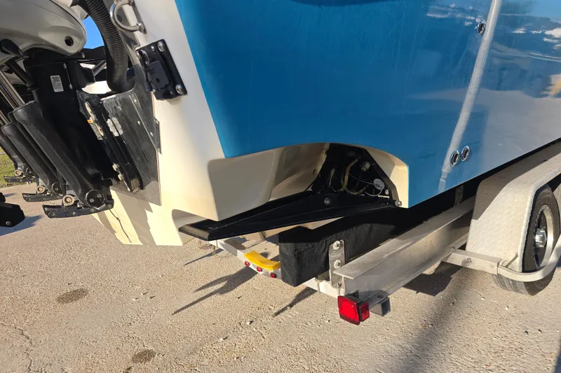 Slide: The Image of 2012 Fountain 38 CC Tournament Edition boat on trailer, rear view. - 9