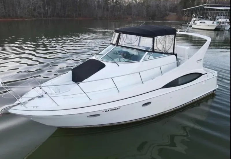 The Image of 1999 Carver 350 Mariner boat on a calm lake. - 0