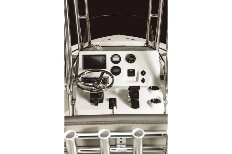 Slide: The Image of 2026 Key West 203 FS boat dashboard with steering wheel and control panel. - 15