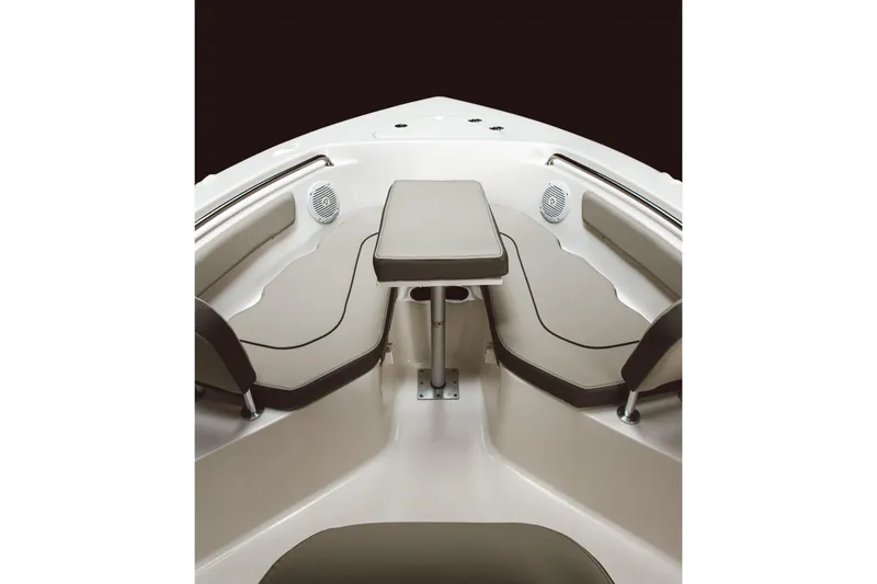 Slide: The Image of 2026 Key West 203 FS boat interior with cushioned seating and table. - 16