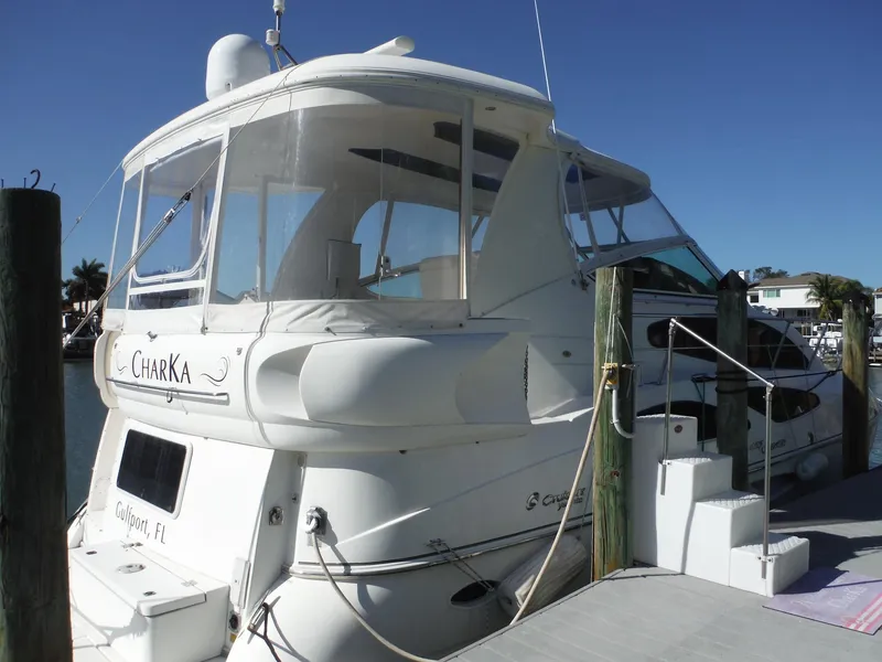 Slide: The Image of 2005 Cruisers Yachts 455 Express Motoryacht docked at marina. - 2