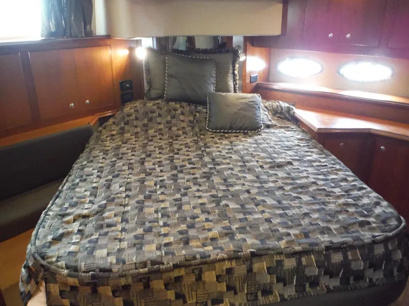 Slide: The Image of Luxurious bedroom in 2005 Cruisers Yachts 455 Express Motoryacht with cozy bedding. - 43