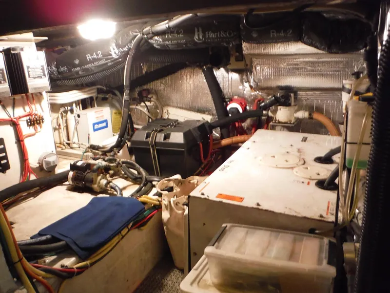 Slide: The Image of Engine room of a 2005 Cruisers Yachts 455 Express Motoryacht with various mechanical components. - 46