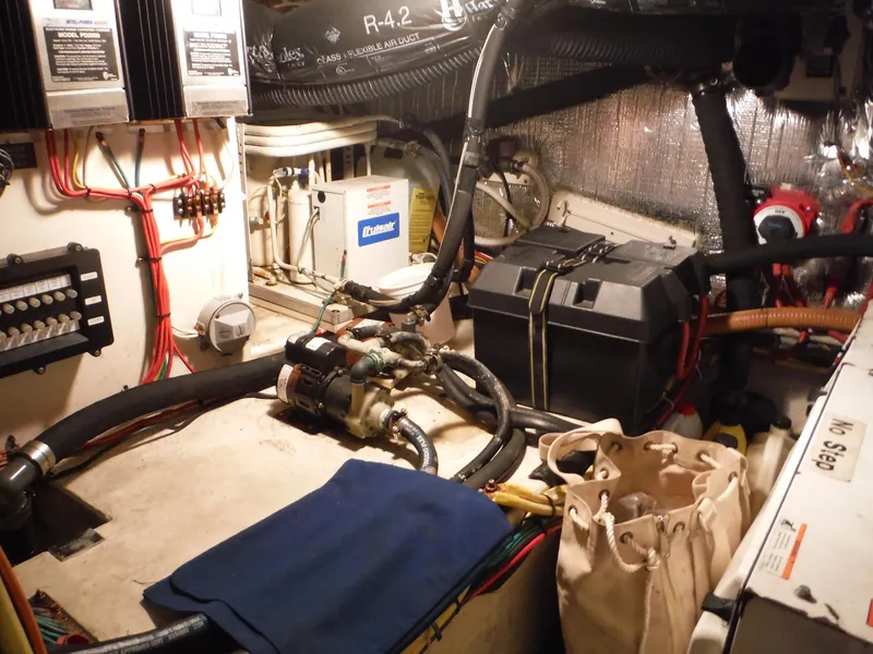 Slide: The Image of 2005 Cruisers Yachts 455 Express Motoryacht engine room with equipment and wiring. - 47