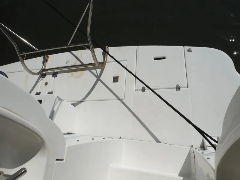 Slide: The Image of 2005 Cruisers Yachts 455 Express Motoryacht deck with storage compartments and railing. - 6