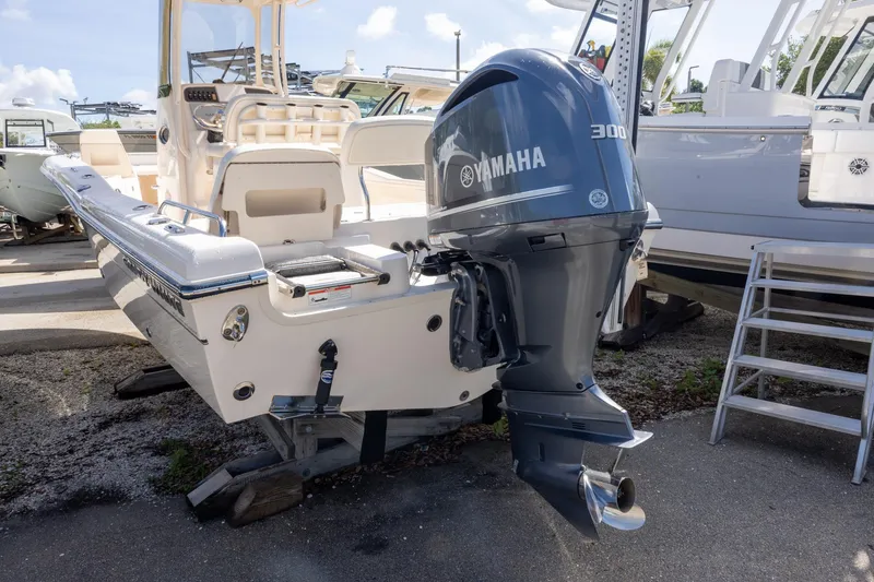 Slide: The Image of 2021 Grady-White 251 Coastal Explorer with Yamaha 300 engine, docked outdoors. - 2