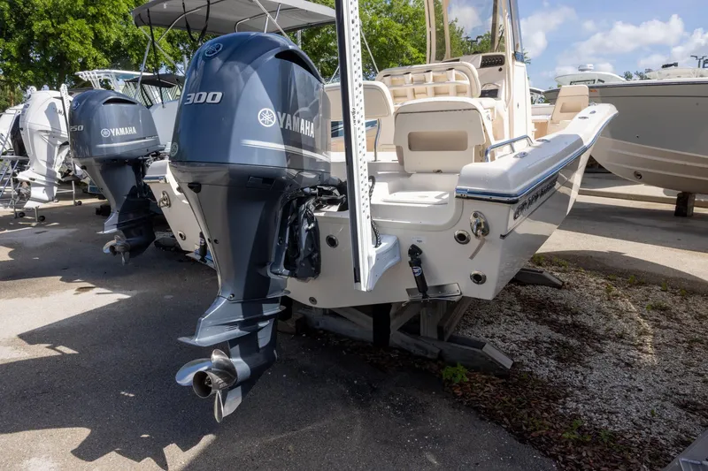Slide: The Image of 2021 Grady-White 251 Coastal Explorer with Yamaha 300 outboard engine, docked outdoors. - 3