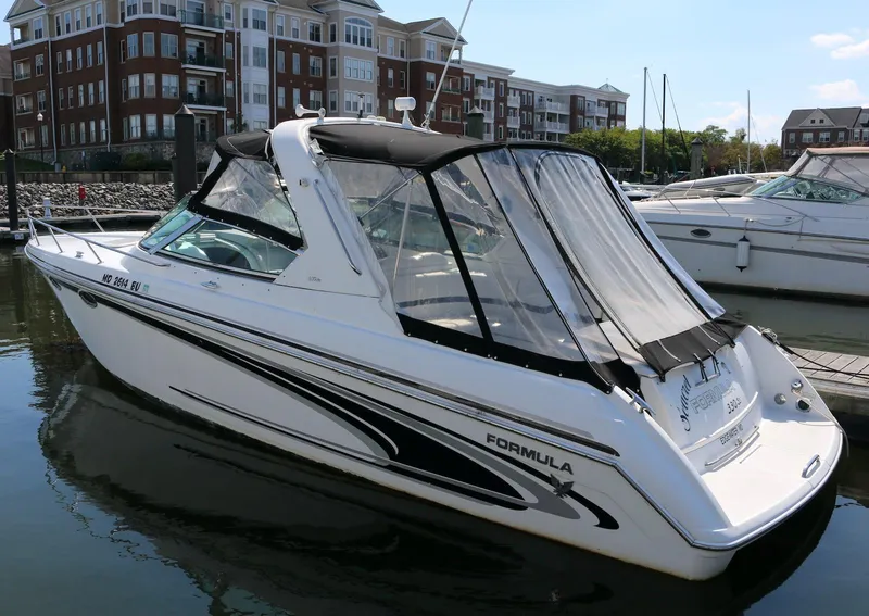 The Image of 2005 Formula 330 Sun Sport boat docked in a marina. - 0