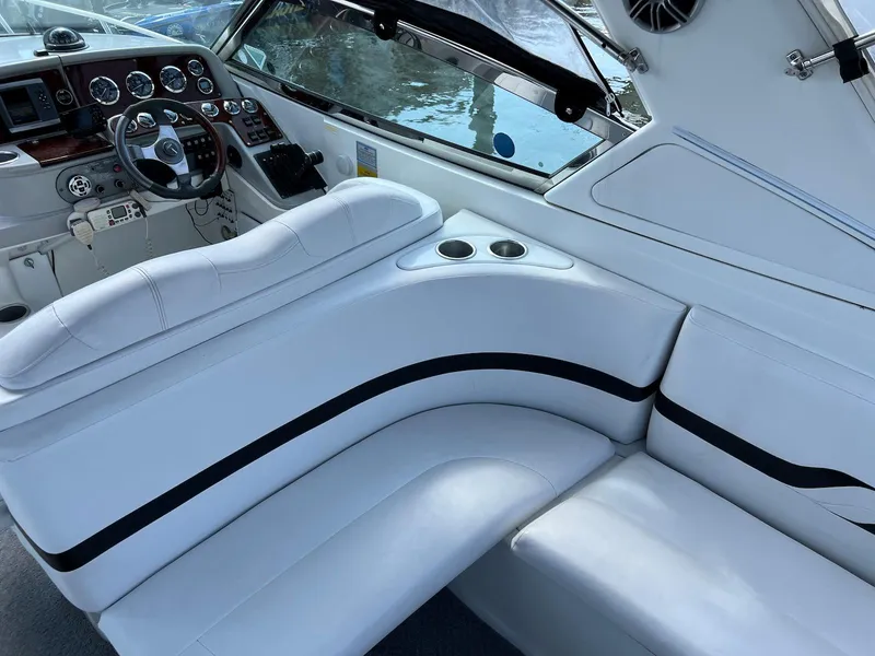 Slide: The Image of 2005 Formula 330 Sun Sport boat interior with white seating and dashboard. - 10