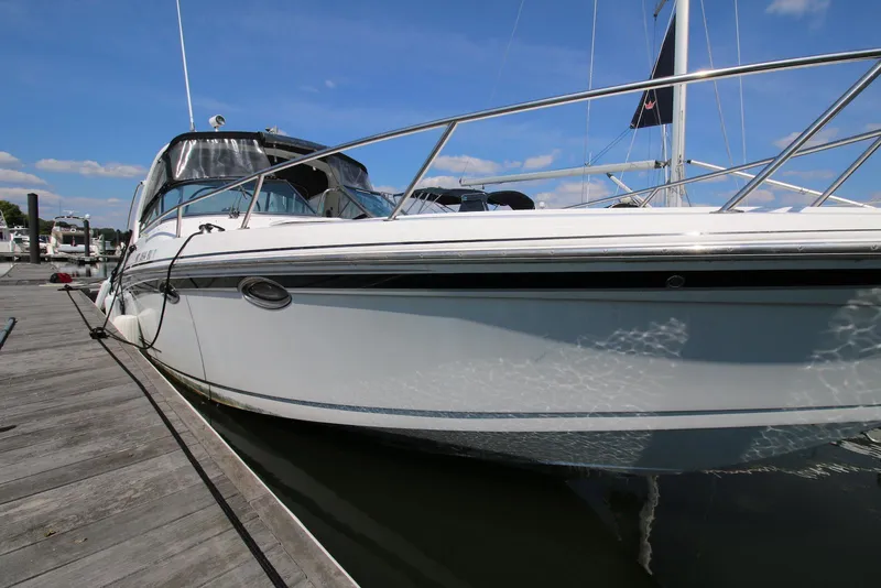 Slide: The Image of 2005 Formula 330 Sun Sport boat docked at a marina on a sunny day. - 12