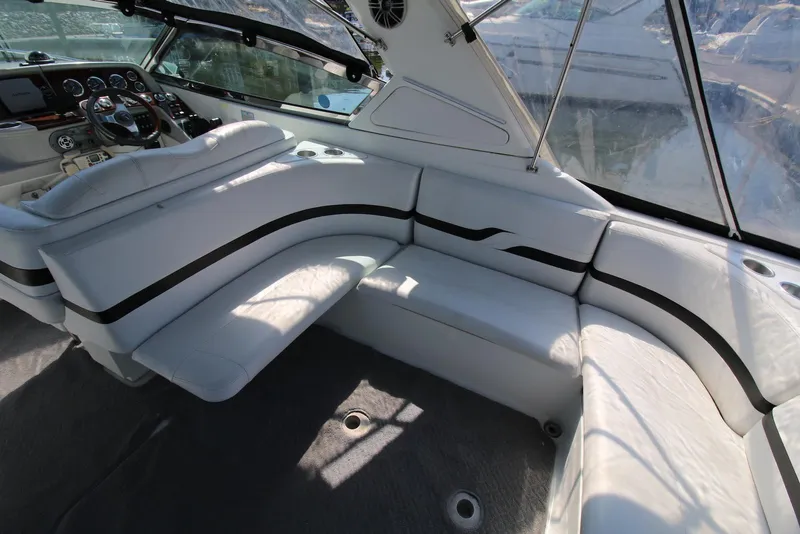 Slide: The Image of 2005 Formula 330 Sun Sport boat interior with white seating and black accents. - 13