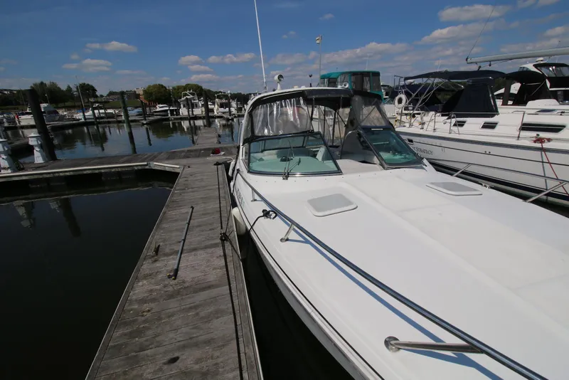 Slide: The Image of 2005 Formula 330 Sun Sport docked at a marina on a sunny day. - 14