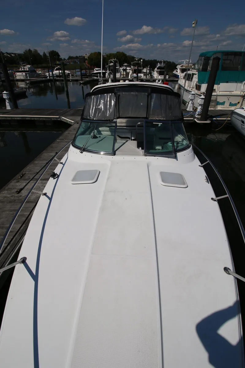 Slide: The Image of 2005 Formula 330 Sun Sport docked at a marina on a sunny day. - 16