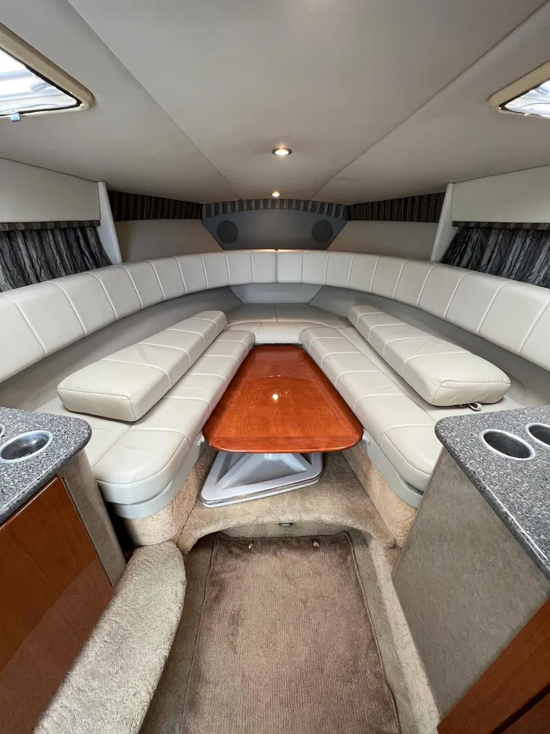 Slide: The Image of Interior cabin of a 2005 Formula 330 Sun Sport boat with seating and table. - 20