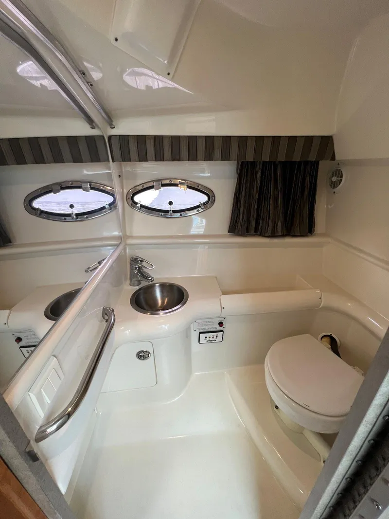 Slide: The Image of 2005 Formula 330 Sun Sport boat bathroom with sink and toilet. - 22