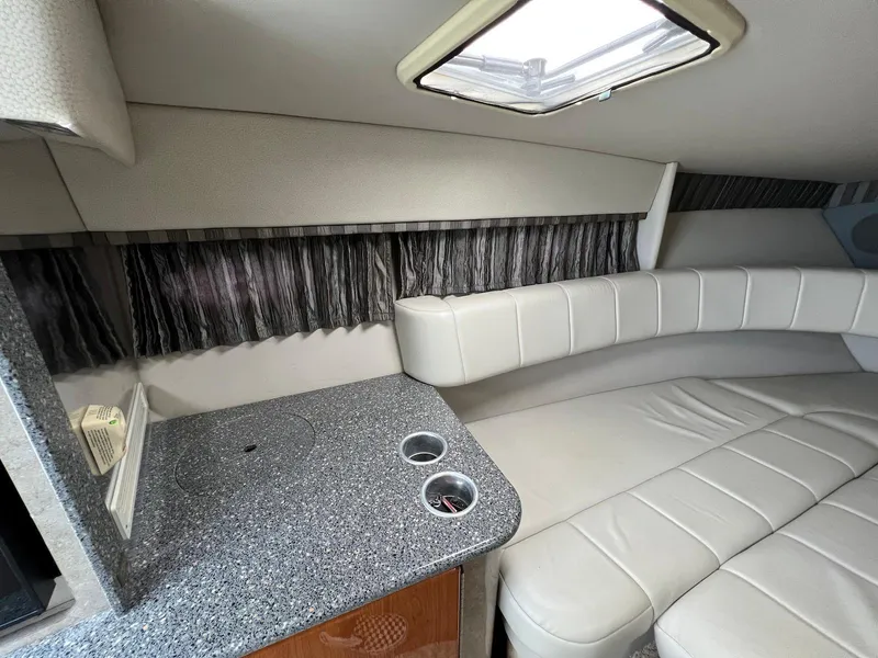 Slide: The Image of Interior cabin of a 2005 Formula 330 Sun Sport boat with seating and countertop. - 24