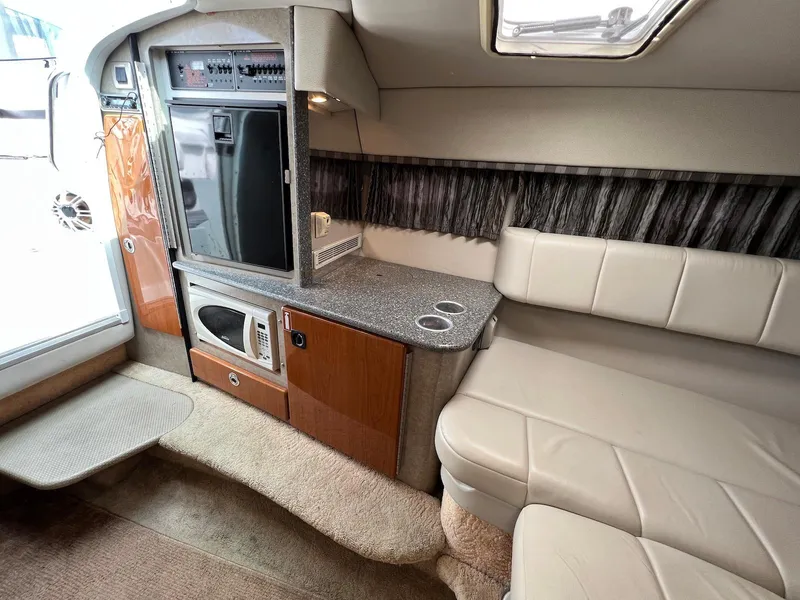 Slide: The Image of 2005 Formula 330 Sun Sport cabin interior with kitchenette and seating area. - 26