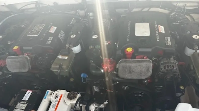 Slide: The Image of 2005 Formula 330 Sun Sport engine compartment with dual Volvo Penta engines. - 28