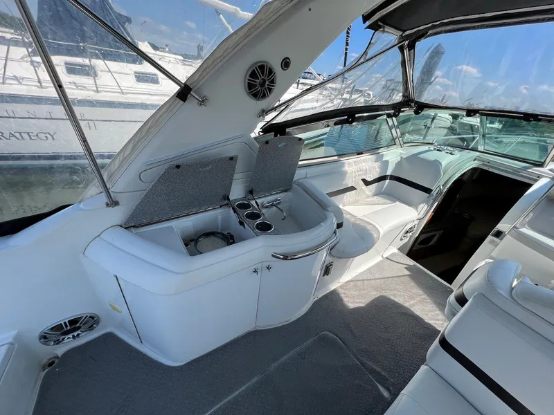 Slide: The Image of 2005 Formula 330 Sun Sport boat interior with seating and storage. - 6