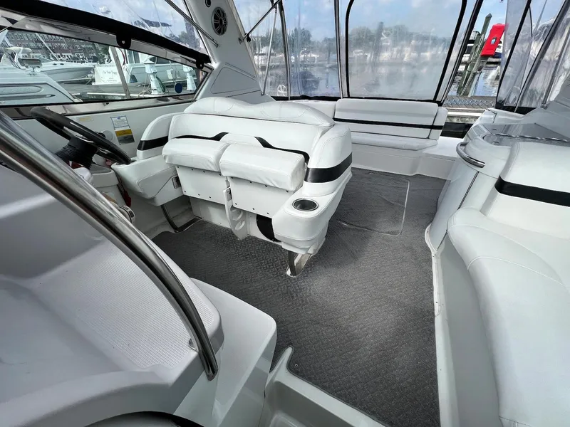 Slide: The Image of Interior of a 2005 Formula 330 Sun Sport boat with white seating and grey carpet. - 7