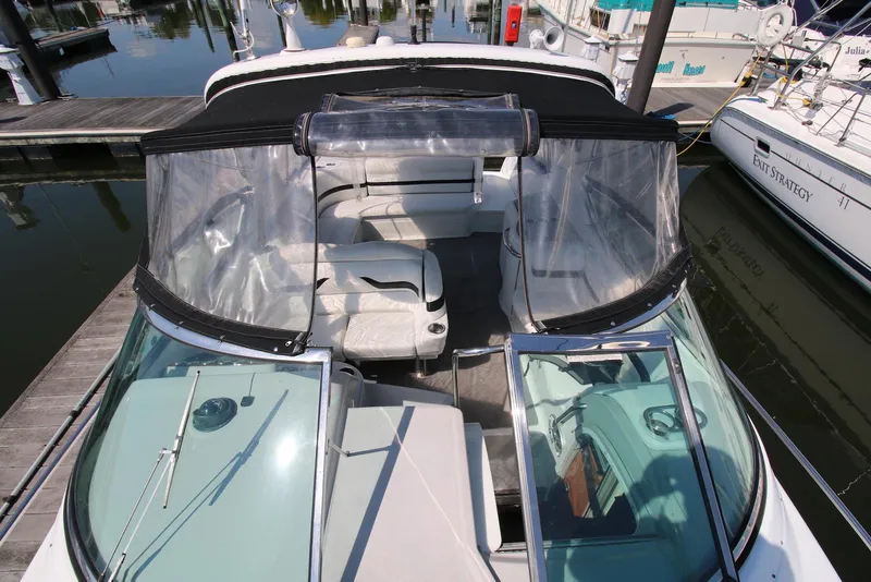 Slide: The Image of 2005 Formula 330 Sun Sport boat with clear canopy docked at marina. - 8