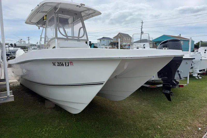 The Image of 2018 Twin Vee 260 CC SE boat with outboard motor, parked on grass. - 1