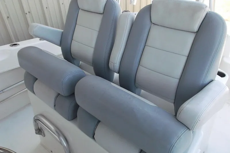 Slide: The Image of 2018 Twin Vee 260 CC SE boat seats, featuring plush gray and white upholstery. - 10