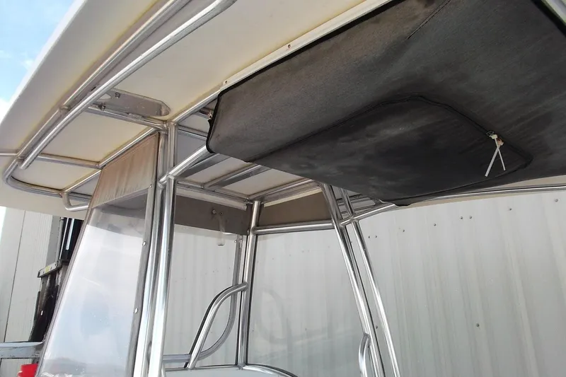 Slide: The Image of 2018 Twin Vee 260 CC SE boat with T-top and storage compartment. - 12