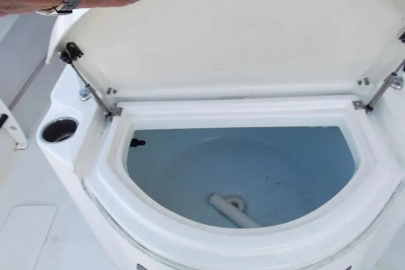 Slide: The Image of Open storage compartment on 2018 Twin Vee 260 CC SE boat. - 13