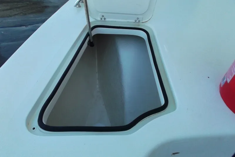Slide: The Image of Open storage compartment on 2018 Twin Vee 260 CC SE boat deck. - 15