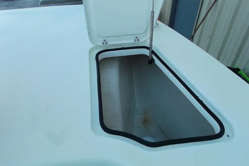 Slide: The Image of Open storage compartment on a 2018 Twin Vee 260 CC SE boat. - 16