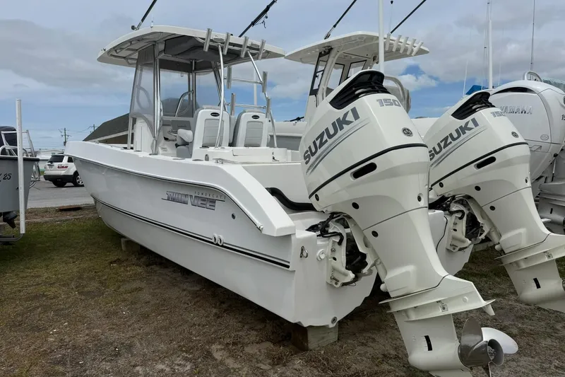 Slide: The Image of 2018 Twin Vee 260 CC SE boat with dual Suzuki outboard motors. - 5