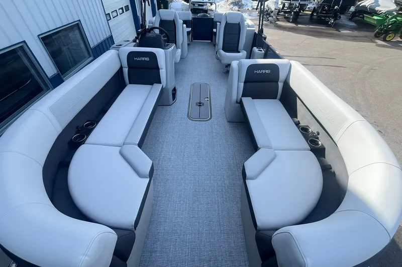 Slide: The Image of 2026 Harris Cruiser 230 CWDH pontoon boat interior with spacious seating and modern design. - 12