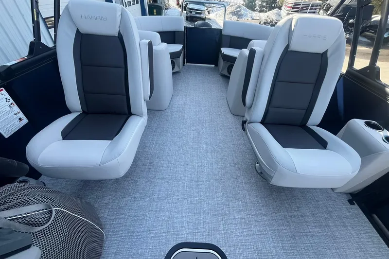 Slide: The Image of 2026 Harris Cruiser 230 CWDH boat interior with luxurious seating and modern design. - 13