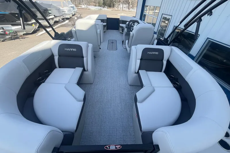 Slide: The Image of 2026 Harris Cruiser 230 CWDH pontoon boat interior with plush seating and modern design. - 18