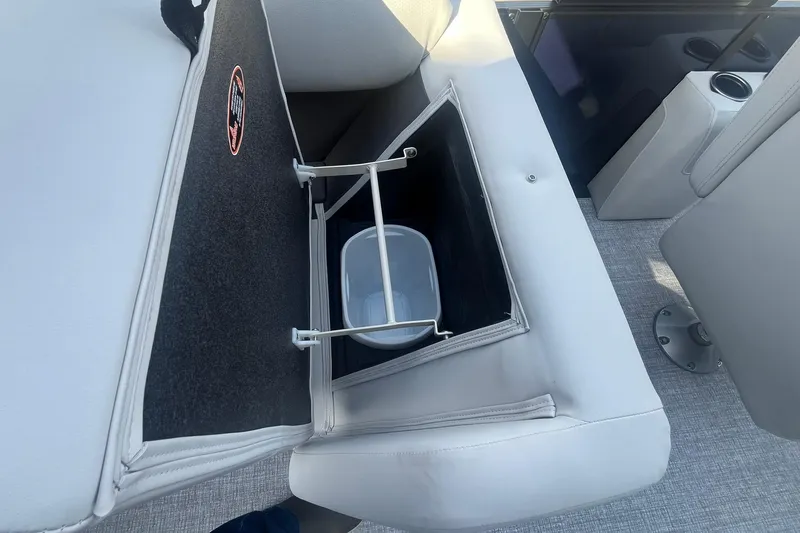 Slide: The Image of Storage compartment on 2026 Harris Cruiser 230 CWDH boat with integrated cooler. - 19