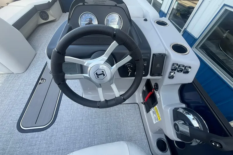 Slide: The Image of Steering console of 2026 Harris Cruiser 230 CWDH pontoon boat with modern controls. - 23
