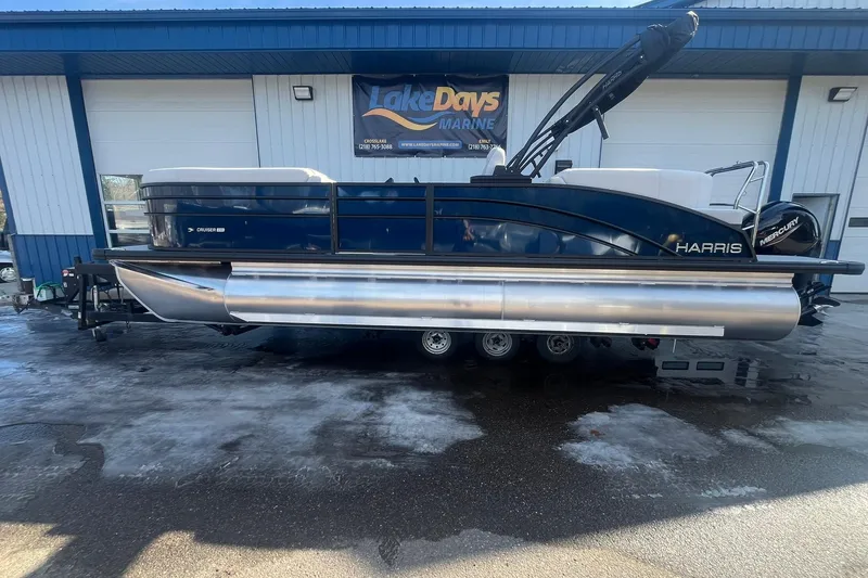 The Image of 2026 Harris Cruiser 230 CWDH pontoon boat on trailer outside Lake Days Marine. - 5