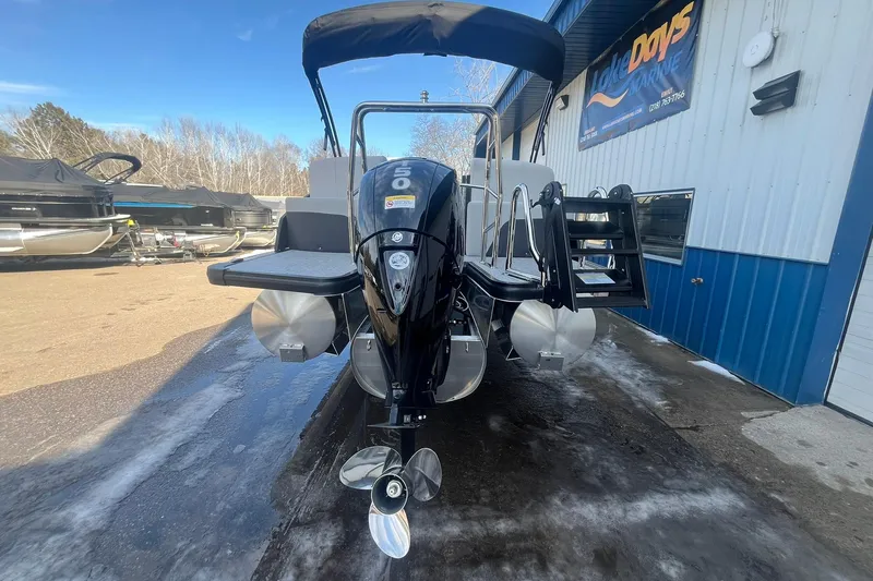 Slide: The Image of 2026 Harris Cruiser 230 CWDH pontoon boat with outboard motor at marina. - 8