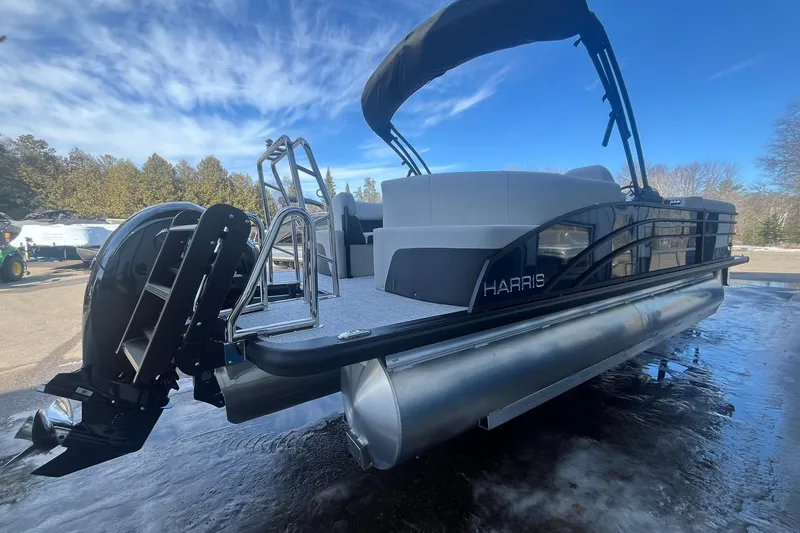 Slide: The Image of 2026 Harris Cruiser 230 CWDH pontoon boat with sleek design and modern features. - 9